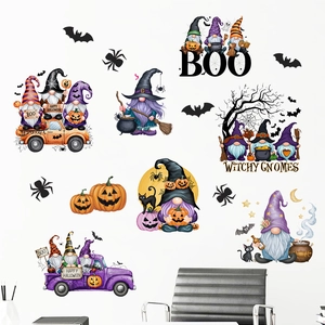 Detailed view of Halloween wall decals featuring gnomes, pumpkins, and bats on a white wall