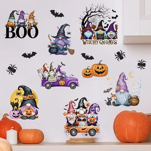Detail of Halloween gnome wall decals with pumpkins and bats on a white interior wall