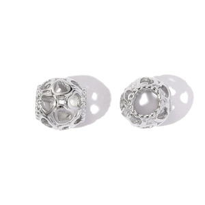 Detailed macro view of heart-shaped hollow stainless steel spacer charms for DIY bracelets