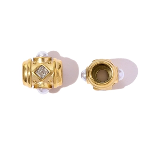 Detail of matte gold cylinder bead featuring square crystal and four pearl accents