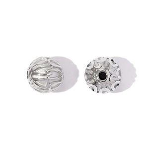 Polished silver stainless steel hollow spacer bead showing intricate cutout patterns