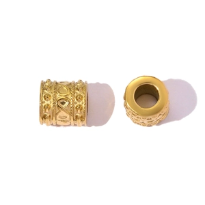 Detail of golden hollow spacer beads with embossed infinity pattern for DIY jewelry