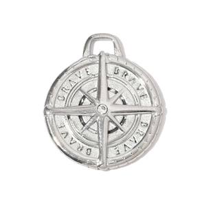 Detailed macro view of silver brushed pendant featuring BRAVE engraving and zircon stone