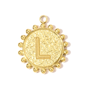 Macro detail of golden hammered round pendant featuring embossed letter L and beaded edge
