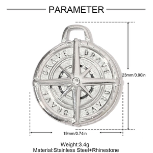 Macro detail of silver stainless steel compass pendant with BRAVE engraving and crystal
