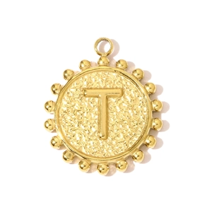 Macro shot of 18k gold plated letter T coin pendant with hammered texture and beaded edge