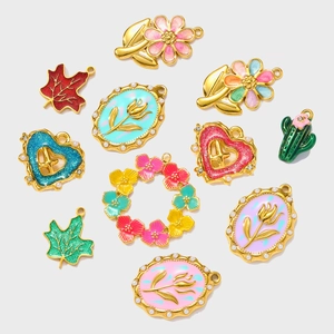 Detailed set of colorful enamel pendants featuring flowers, leaves and cactus in gold finish
