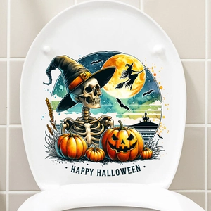 Close-up of Halloween toilet lid decal featuring skeletons, pumpkins and wizard hats