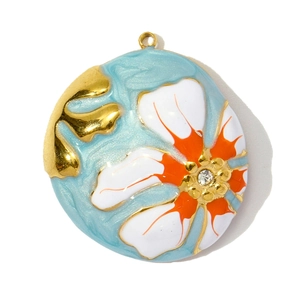 Detail of round flower pendant with blue enamel, orange floral motif and zircon center