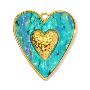 Detail of heart pendant with teal marble resin and hammered gold metal texture