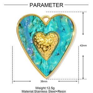 Detail view of heart pendant with green marble resin texture and gold-plated stainless steel