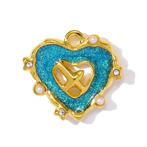 Detailed view of heart-shaped stainless steel pendant with blue enamel and aircraft motif