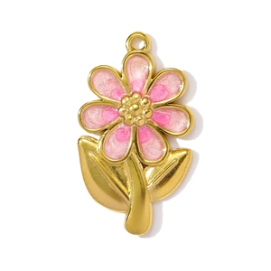 Macro detail of gold flower pendant with pink enamel and sparkling finish