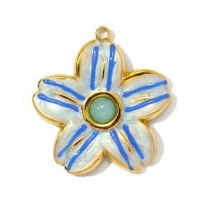 Detail of flower pendant with blue striped enamel and green gemstone center