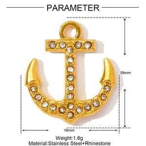 Macro view of gold anchor pendant with rhinestones and size parameters listed