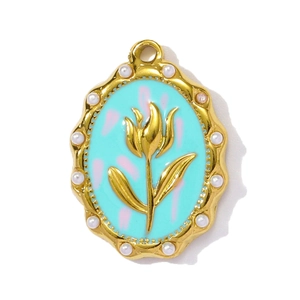 Detail view of oval tulip pendant with mint green enamel, gold relief, and pearl border