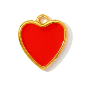 Detail of a red heart-shaped pendant with golden metal edges and integrated bail