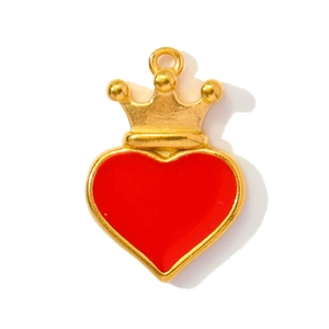 Detailed close-up of a red heart pendant with a golden crown and polished finish
