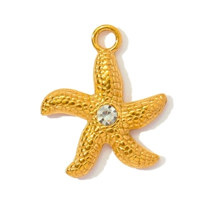 Detailed view of a gold starfish pendant with textured surface and center crystal inlay