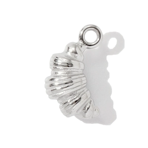 Macro view of silver croissant shaped stainless steel pendant charm with spiral texture
