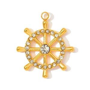 Macro view of gold plated nautical ship wheel pendant set with white crystals