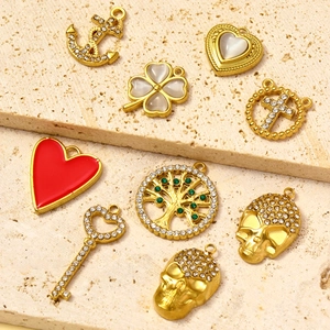 18K gold plated stainless steel pendants with heart, tree of life, and skull motifs