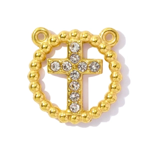 Detailed view of a gold-plated circular cross charm with white rhinestones and side rings