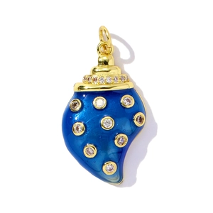 Macro shot of a conch-shaped pendant featuring blue enamel and sparkling cubic zirconia stones