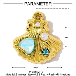 Detailed view of scallop shell pendant with blue heart stone and white faux pearls