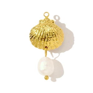 Detail of golden seashell pendant with a white pearl drop and delicate metal textures