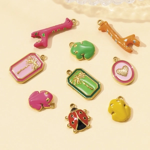 Set of colorful enamel animal charms like giraffe and frog for DIY necklaces