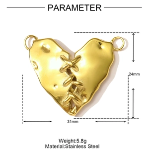 Detail of a vintage golden stainless steel heart pendant with unique stitched texture