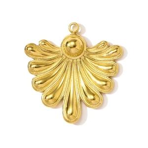 Close-up of golden fan-shaped stainless steel pendant with textured shell details