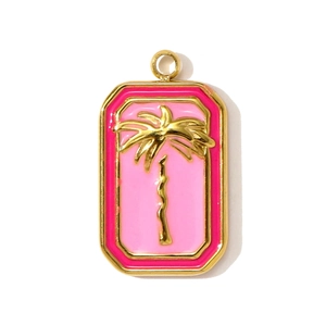 Detailed macro of gold rectangular pendant with pink enamel and a 3D palm tree relief
