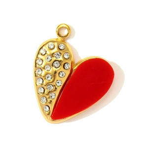 Detailed macro of heart pendant featuring red enamel and sparkling rhinestones inlay
