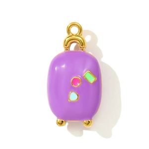 Detailed view of a purple enamel suitcase pendant with gold accents and colorful motifs