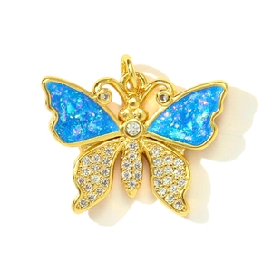Detailed view of butterfly charm with blue opal wings and white zircon stones