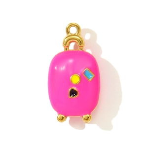 Detailed macro view of a rose pink suitcase pendant with colorful enamel and gold plating