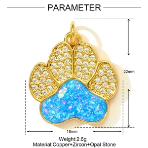 Detail of copper cat paw pendant with light blue opal and white zircon stone inlay