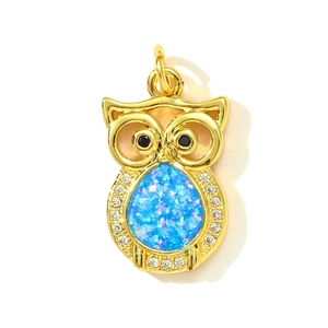 Golden owl pendant with blue opal stone and shimmering crystal accents for jewelry making