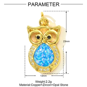 Detailed macro view of owl charm with blue opal stone and zircon in gold-plated copper