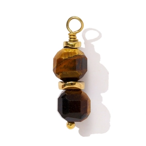 Detailed view of faceted tiger eye stone pendant with gold-plated stainless steel setting