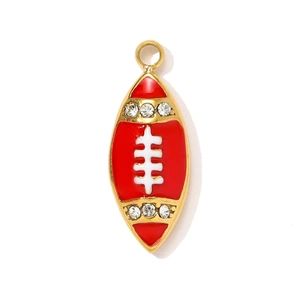 Close-up of a red rugby charm pendant with gold edges and sparkling rhinestones