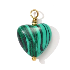 Detailed macro view of heart-shaped malachite stone pendant with gold wire wrapping