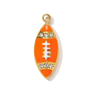 Detail of rugby charm pendant with orange enamel finish and sparkling crystal accents