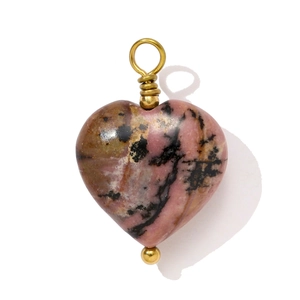 Macro shot of heart-shaped rhodonite stone pendant with gold wire wrap detail