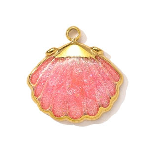 Detailed view of pink shell pendant with gold metal edges and glittering finish