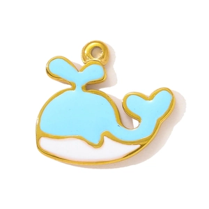 Macro detail of whale-shaped blue enamel pendant with gold plating for jewelry making