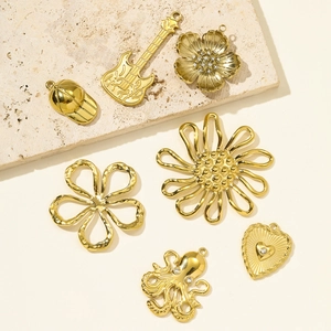 Golden stainless steel pendant set featuring guitar, octopus and floral jewelry charms
