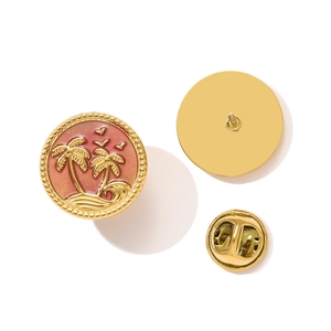 Detail of pink enamel palm tree brooch with golden beads and butterfly clutch back